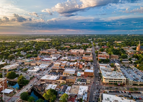 AI generated aerial view of downtown Naperville surrounded by buildings photo
