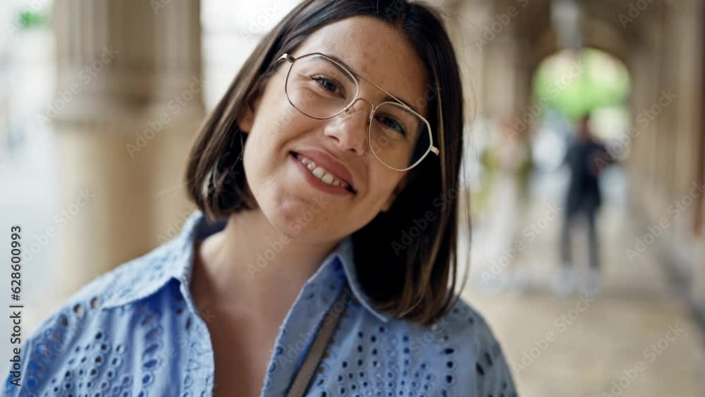 Young beautiful hispanic woman smiling confident standing in the streets of Vienna Young beautiful hispanic woman smiling confident standing in the streets of Vienna