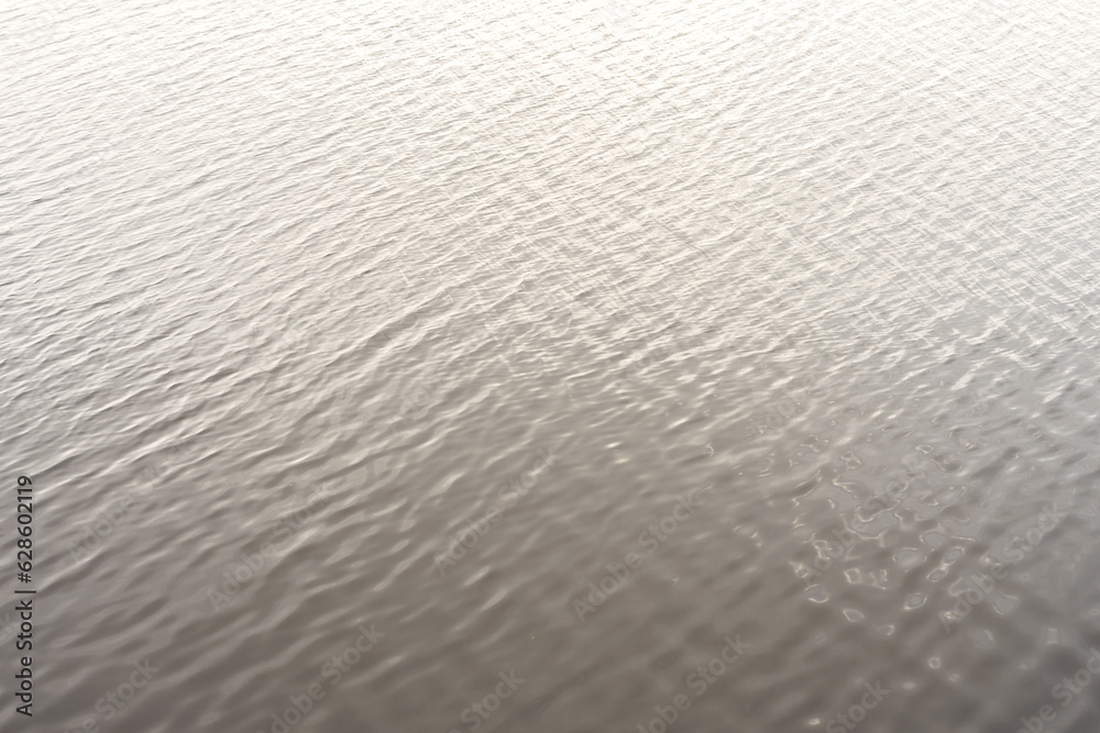 Obraz premium lake gray water smooth surface simple nature background