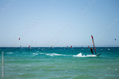 Kitesurfing on Valdevaqueros beach, Gibraltar Strait in Tarifa, Spain on June 17, 2023