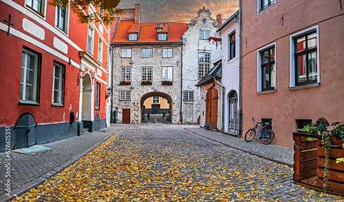 Medieval street in old town of  Riga - the capital and largest city of Latvia, a major commercial, cultural, historical and tourist center of the Baltic region