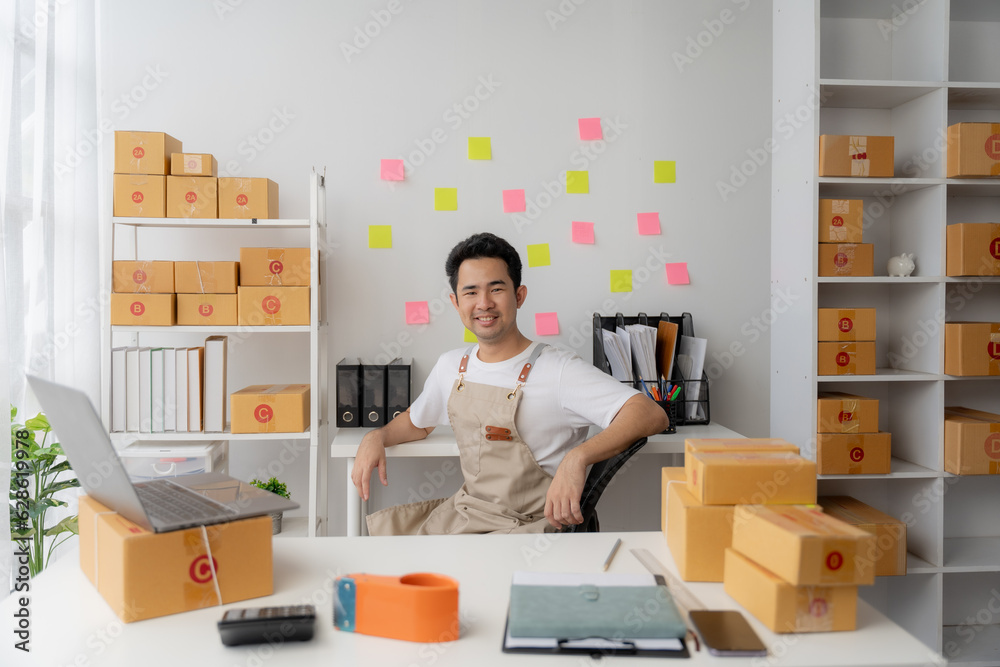 Starting small businesses SME owners, two check online orders Selling products working with boxs freelance work at home office using tablet and laptop marketing, packaging, concept Starting small businesses SME owners, two check online orders Selling products working with boxs freelance work at home office using tablet and laptop marketing, packaging, concept