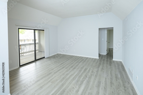 Empty apartment living room with white walls