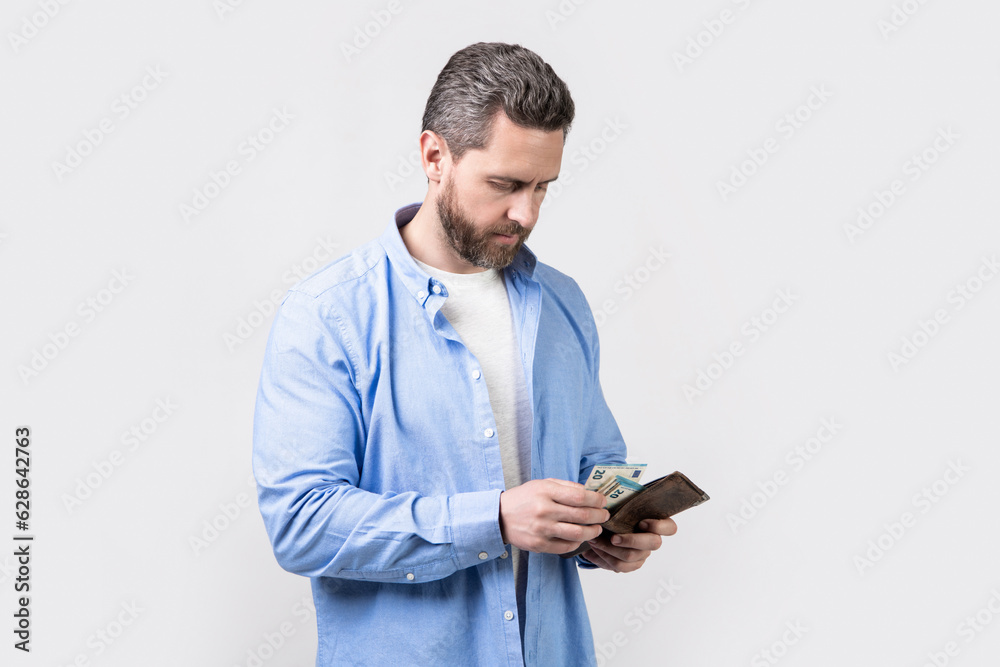 man pay money in wallet isolated on studio background. man pay money in studio. man pay money in wallet isolated on studio background. man pay money in studio.