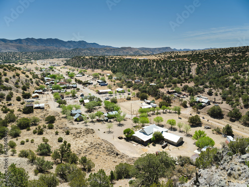 The ghost town of Chloride, New Mexico, seen from above with motorcycles on the road below
