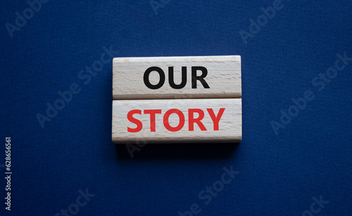 Our story symbol. Wooden blocks with words Our story Beautiful deep blue background. Business and Our story concept. Copy space.