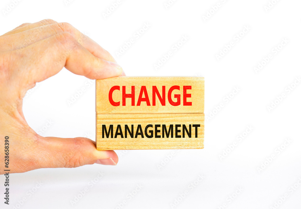 Change management symbol. Concept words Change management on beautiful wooden block. Beautiful white table white background. Businessman hand. Business change management concept. Copy space. Change management symbol. Concept words Change management on beautiful wooden block. Beautiful white table white background. Businessman hand. Business change management concept. Copy space.