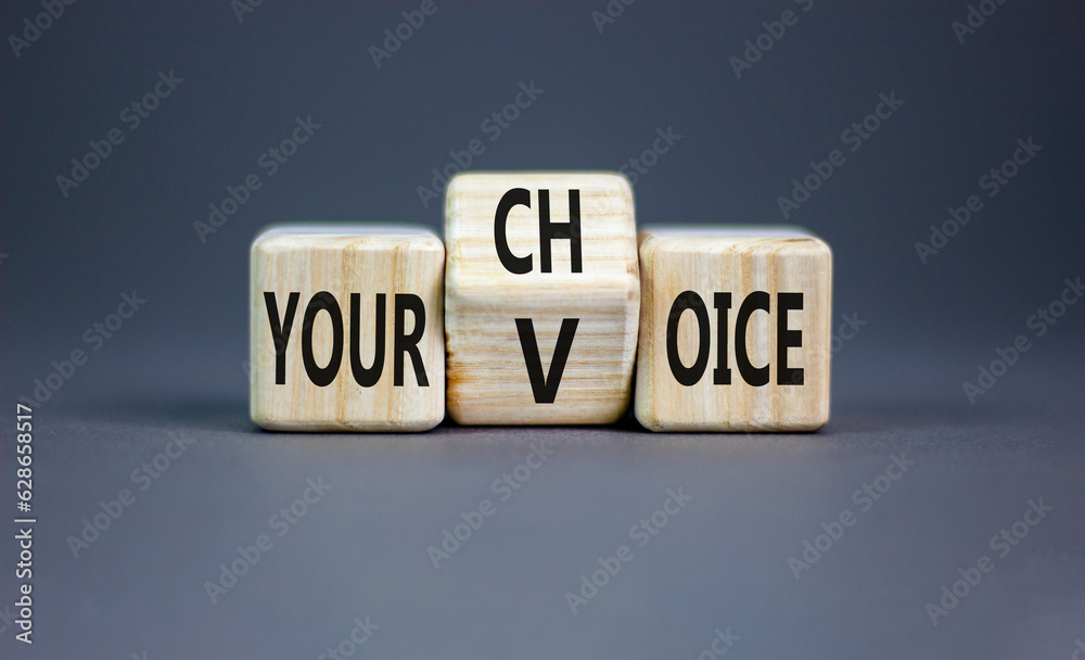 Your voice choice symbol. Businessman turns wooden cubes and changes the concept word Your choice to voice. Beautiful grey table grey background, copy space. Business and your voice choice concept Your voice choice symbol. Businessman turns wooden cubes and changes the concept word Your choice to voice. Beautiful grey table grey background, copy space. Business and your voice choice concept