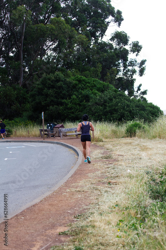 Woman And Man Jogging In Regional Park