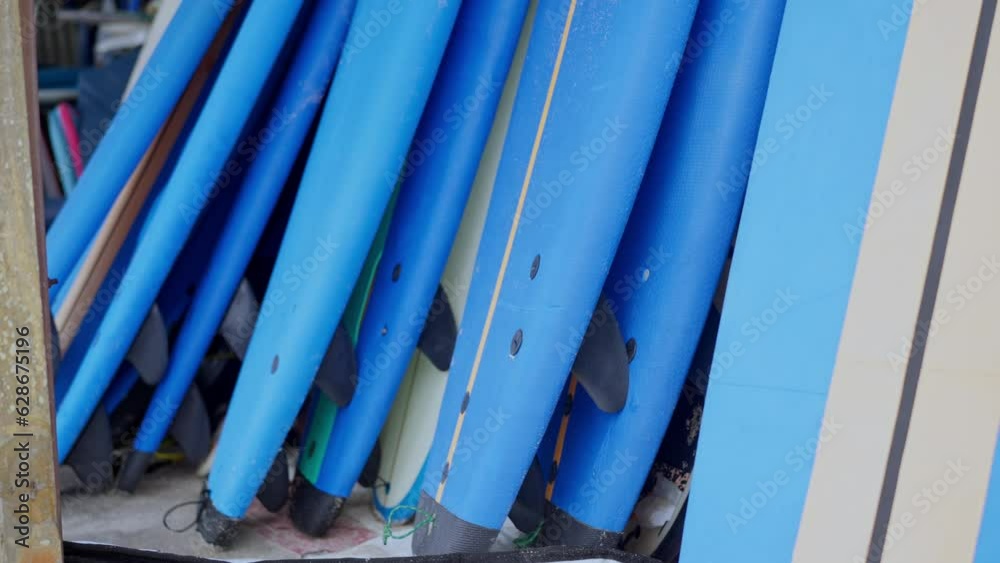 Surfboard pattern in azure blue shades along the wall. Slow motion. 4K Surfboard pattern in azure blue shades along the wall. Slow motion. 4K