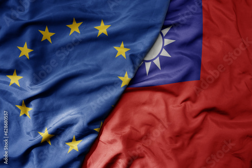 big waving realistic national colorful flag of european union and national flag of taiwan .