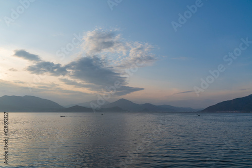 lakeside view and sunset light cloudy sky and colorful water © Aytug Bayer