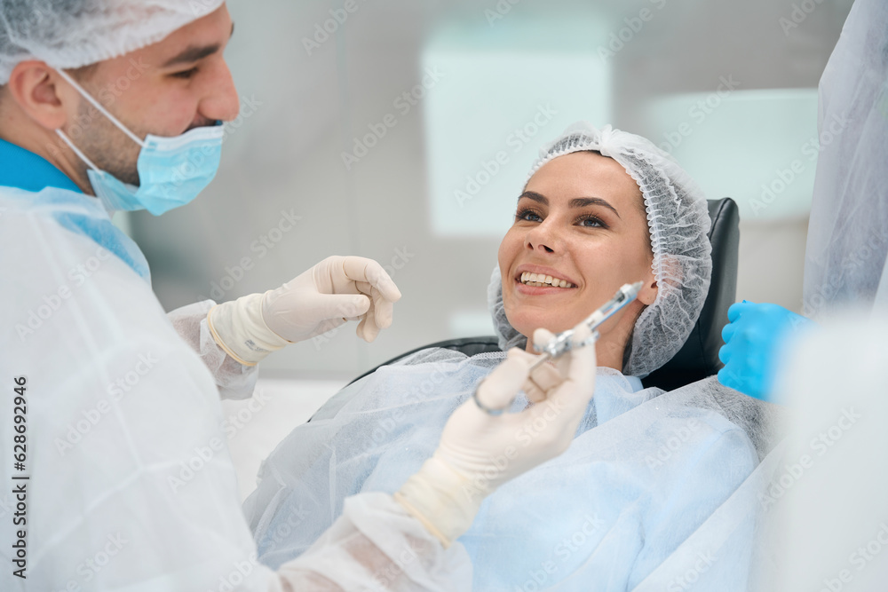 Young woman sits in a dental chair