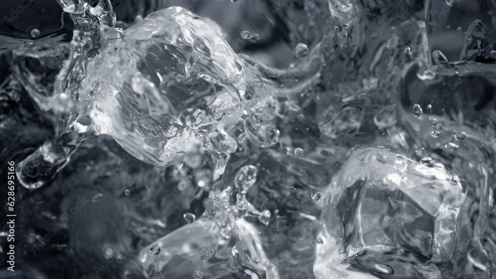 Super Slow Motion Shot of Falling and Splashing Perfect Ice Cubes into Water at 1000fps. Super Slow Motion Shot of Falling and Splashing Perfect Ice Cubes into Water at 1000fps.