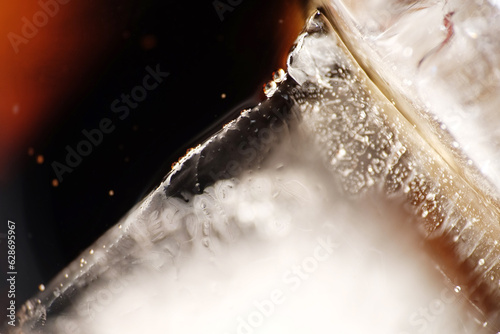 Close up of ice cubes in cola drink © taffpixture