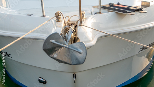 front view of the hull of a yacht's bow and anchor