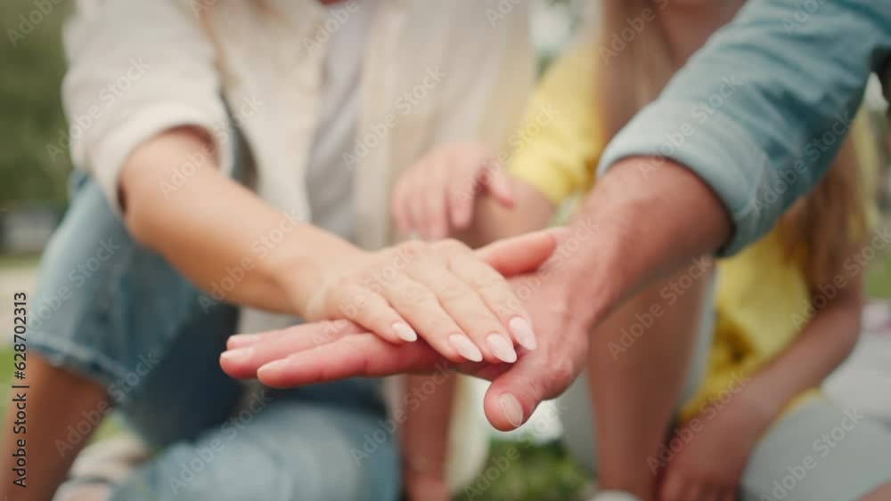 Family and dog alternately put hands and paw on each other Family and dog alternately put hands and paw on each other