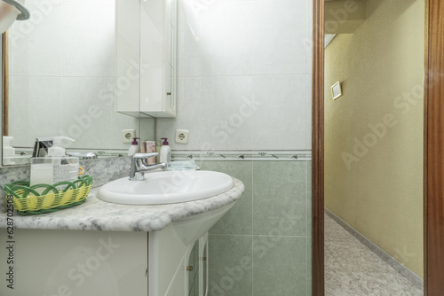 Conventional bathroom complete with washbasin cabinet with mirror and integrated lighting