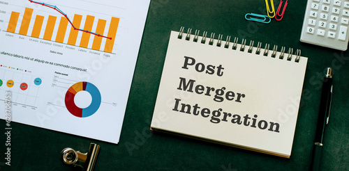 There is notebook with the word Post Merger Integration. It is as an eye-catching image.