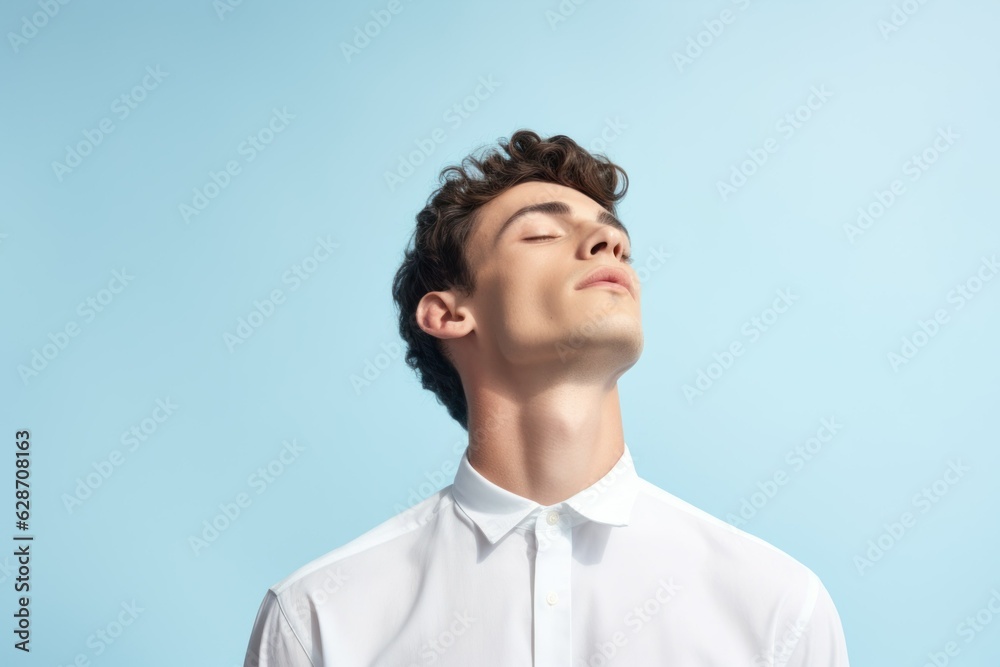 Portrait of a fictional young white man isolated on a light blue background. Generative AI.