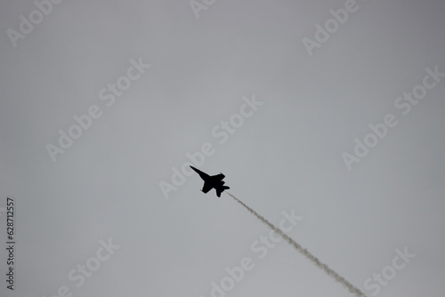 Fototapeta Naklejka Na Ścianę i Meble -  fighter jet silhouette flying