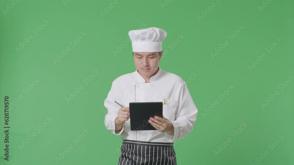 Asian Man Chef Taking Note On A Tablet While Walking In The Green Screen Background Studio
Asian Man Chef Taking Note On A Tablet While Walking In The Green Screen Background Studio