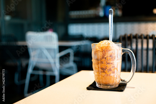 Thai tea ice scoop in glass