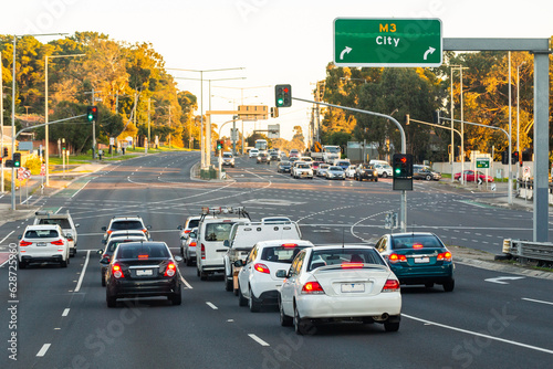 Cars stopped at city traffic lights - multi lane intersection