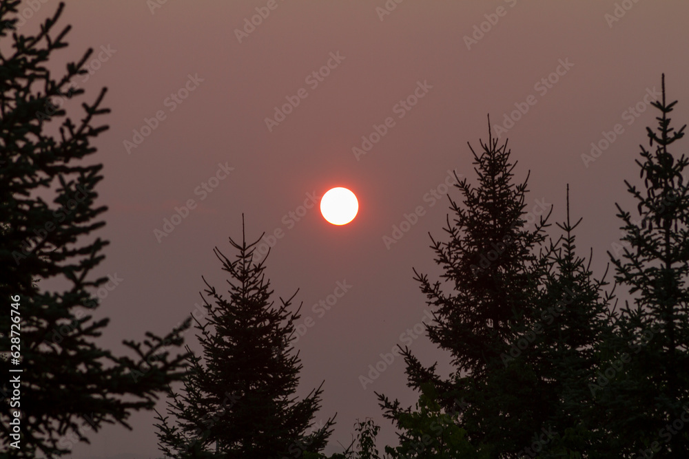 Sunset in a smoky summer afternoon. Sunset in a smoky summer afternoon.
