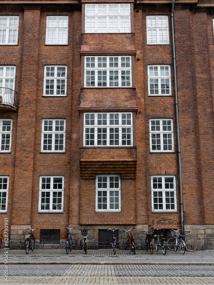 Old building facade and bicycles in front of it.