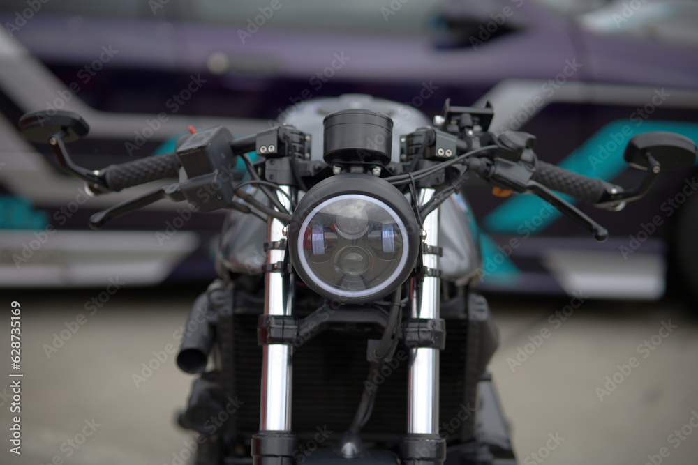Motorcycle detail close-up front fork and headlight
