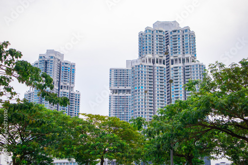 Apartment building in Malaysia with green trees © farizi