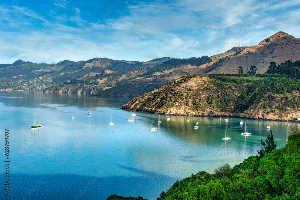 Fototapeta premium Yachts and other sailing vessels moored in the bays at Banks Peninsula