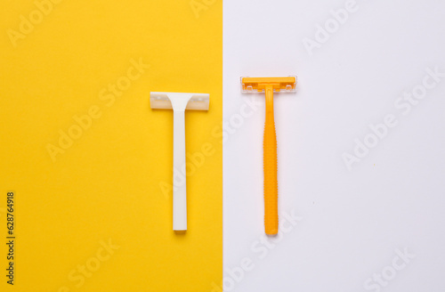 Yellow and white razors on yellow white background