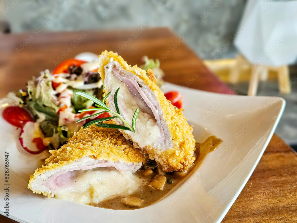 Cordon Bleu Schnitzel,Chicken Cordon Bleu is thin tenderised meat, filled with cheese and ham, coated in breadcrumbs and fried to crisp with Creamy mushroom sauce. Cordon Bleu Schnitzel,Chicken Cordon Bleu is thin tenderised meat, filled with cheese and ham, coated in breadcrumbs and fried to crisp with Creamy mushroom sauce.