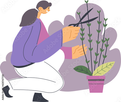Woman gardening and trimming bushes of flower