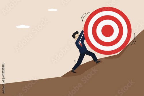 Missed target, difficulty in working hard to achieve target or set too high goal concept, businessman trying hard to push dartboard or arrow target up hill.