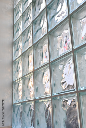 close up glass block wall with golden natural light background, interior design