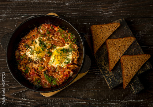 Delicious Shakshuka: A savory Middle Eastern egg dish featuring poached eggs in a rich tomato and bell pepper sauce