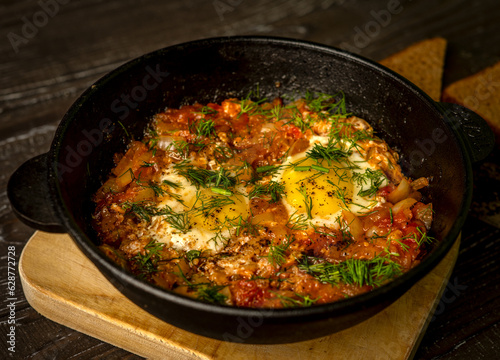 Delicious Shakshuka: A savory Middle Eastern egg dish featuring poached eggs in a rich tomato and bell pepper sauce