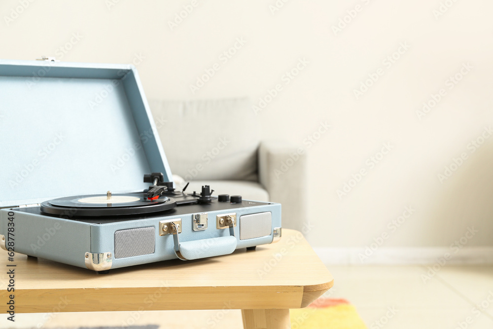 Record player with vinyl disk on table in room Record player with vinyl disk on table in room