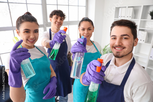 Young janitors with bottles...
