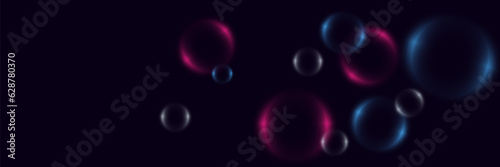 Abstract background with neon bubbles, iridescent colorful glass balls or spheres on a black background.