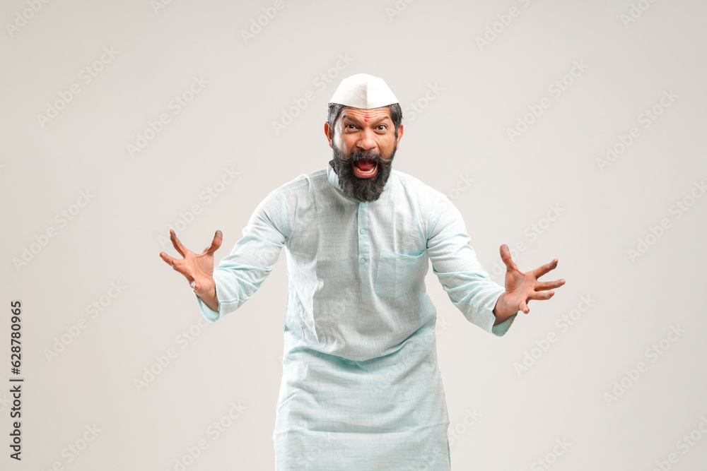 Indian man in traditional wear and giving shouting expression. Indian man in traditional wear and giving shouting expression.