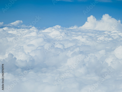 clouds with blue sky background,  Fluffy clouds on the background of the blue sky © natia