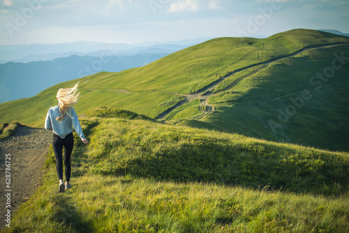 Young Skinny Girl Running into Carpathian Mountains