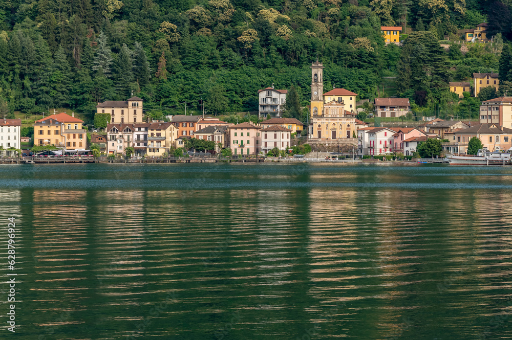 Fototapeta premium Porto Ceresio, Italy, and Lake Lugano in late afternoon light