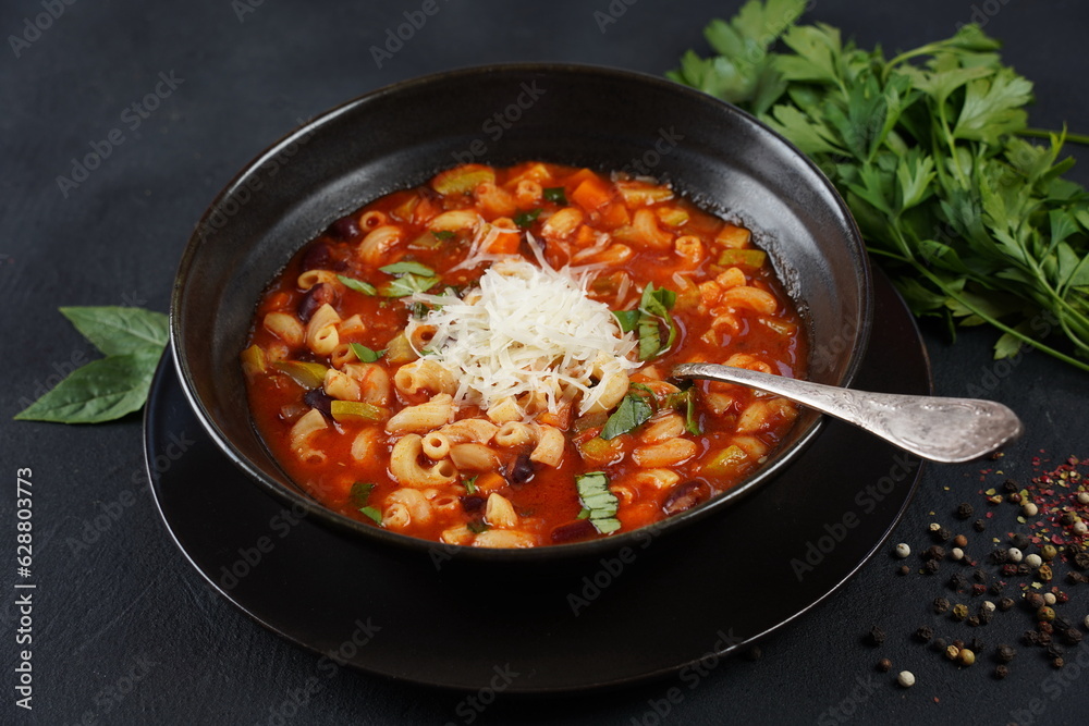 A bowl of minestrone soup with mix of vegetables. Italian cuisine