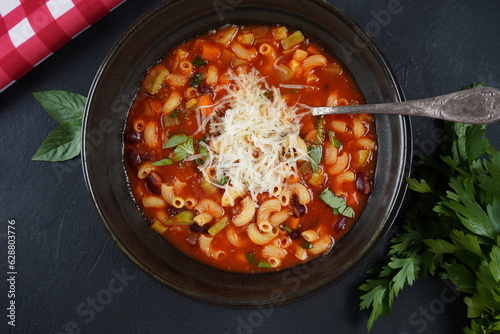 A bowl of minestrone soup with mix of vegetables. Italian cuisine