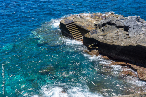 waves crashing on rocks